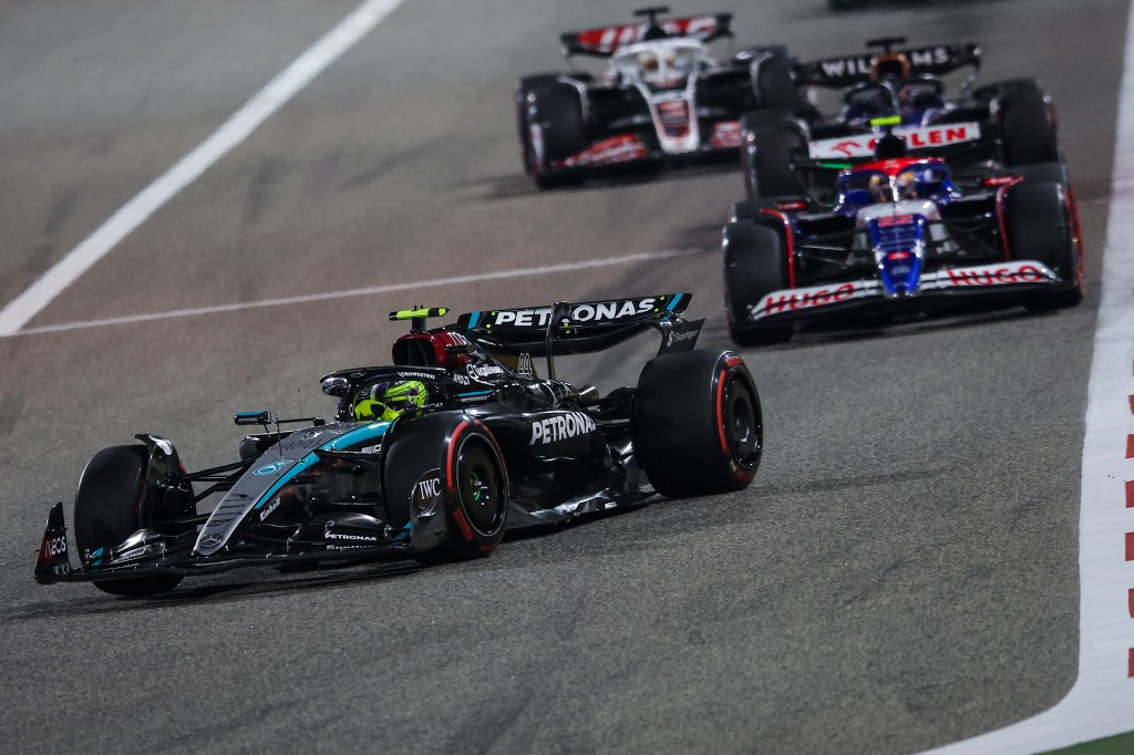 BAHRAIN, BAHRAIN - MARCH 02: Lewis Hamilton of Great Britain driving the (44) Mercedes AMG Petronas F1 Team W15 on track leads the group during the F1 Grand Prix of Bahrain at Bahrain International Circuit on March 02, 2024 in Bahrain, Bahrain. (Photo by Eric Alonso/Getty Images )