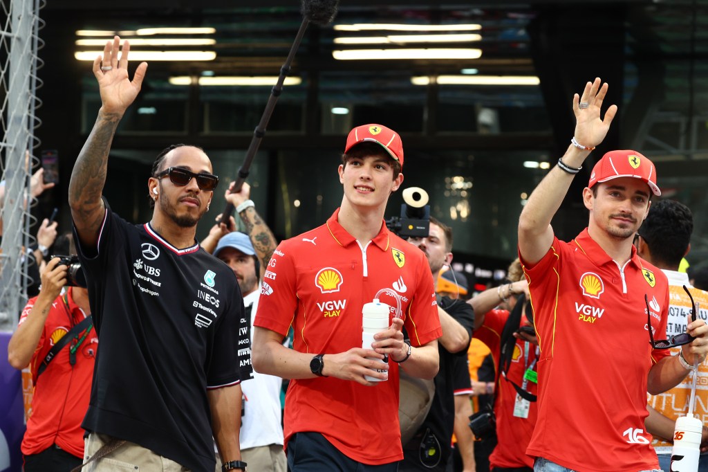 JEDDAH, SAUDI ARABIA - MARCH 09: Oliver Bearman of Great Britain and Ferrari, Lewis Hamilton of Great Britain and Mercedes and Charles Leclerc of Monaco and Ferrari talk on the drivers parade prior to the F1 Grand Prix of Saudi Arabia at Jeddah Corniche Circuit on March 09, 2024 in Jeddah, Saudi Arabia. (Photo by Clive Rose/Getty Images)