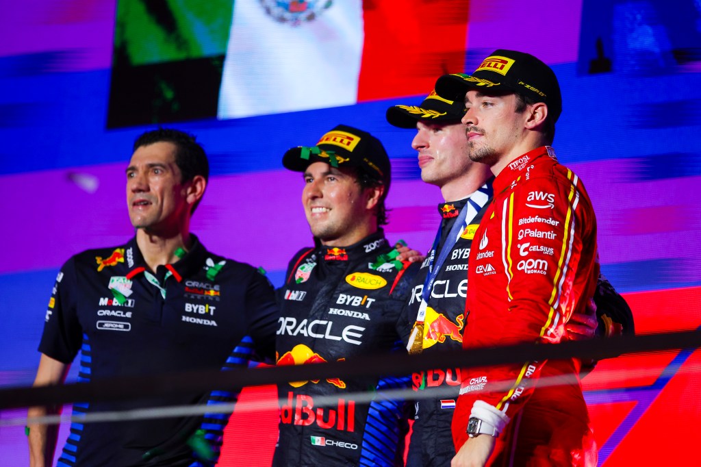 JEDDAH, SAUDI ARABIA - MARCH 09: Race Winner Max Verstappen of Netherland and Oracle Red Bull Racing, second placed Sergio Perez of Mexico and Oracle Red Bull Racing and third placed Charles Leclerc of Monaco and Ferrari celebrates on the podium during the F1 Grand Prix of Saudi Arabia at Jeddah Corniche Circuit on March 09, 2024 in Jeddah, Saudi Arabia. (Photo by Eric Alonso/Getty Images)
