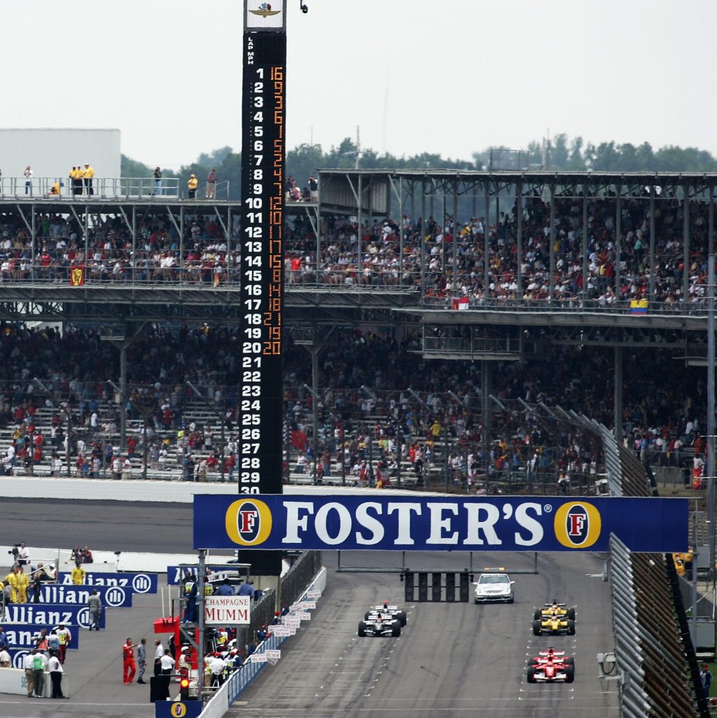INDIANAPOLIS, IN - JUNE 19:  Ferrari, Minardi, and Jordan drivers all line up on the grid to start the race as the teams with Michelin tires all come into the pits to to retire after one lap during the United States F1 Grand Prix at the Indianapolis Motor Speedway on June 19, 2005 in Indianapolis, Indiana.  (Photo by Christopher Lee/Getty Images)