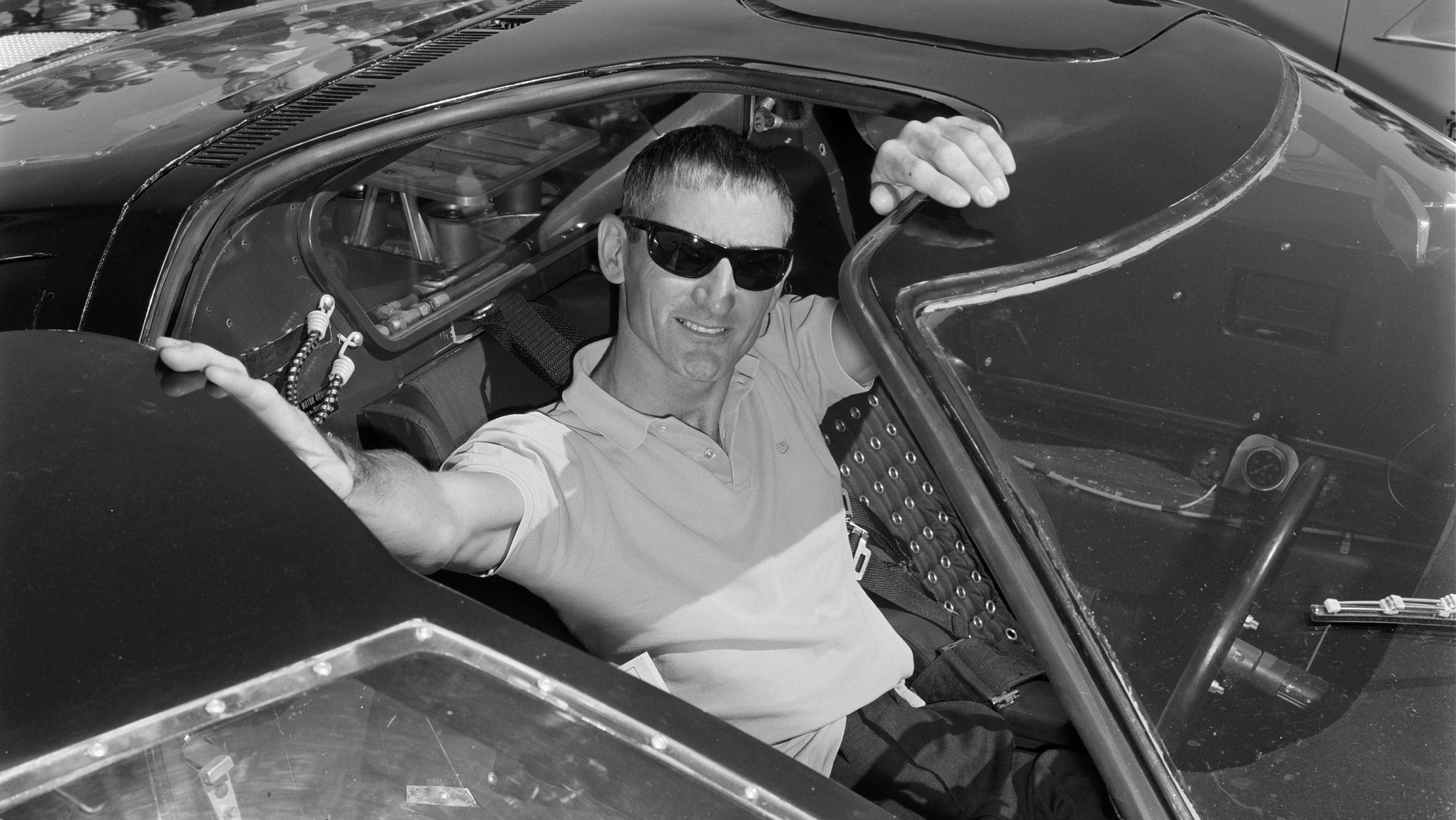 UNITED STATES - SEPTEMBER 22:  1965 Stardust International Raceway Grand Opening. Shelby test driver Ken Miles drives a right-hand drive Ford GT40 to the opening ceremonies.  (Photo by Pat Brollier/The Enthusiast Network via Getty Images/Getty Images)