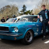 Jim Farley poses with the Alan Mann Racing Ford Mustang at Goodwood Members Meeting 2024