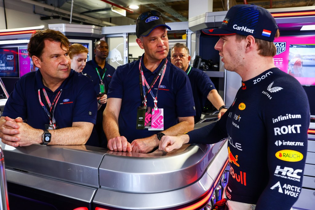 MIAMI, FLORIDA - MAY 07: Jim Farley, CEO of Ford, Mark Rushbrook of Ford and Max Verstappen of the Netherlands and Oracle Red Bull Racing  talk in the garage prior to the F1 Grand Prix of Miami at Miami International Autodrome on May 07, 2023 in Miami, Florida. (Photo by Mark Thompson/Getty Images)