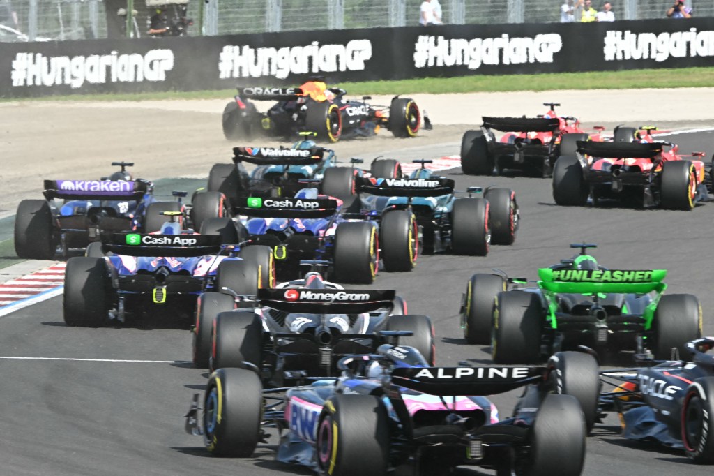 Team Red Bull's Max Verstappen (Top L) leaves the tracks at the start of the Formula One Hungarian Grand Prix at the Hungaroring race track in Mogyorod near Budapest on July 21, 2024. (Photo by Attila KISBENEDEK / AFP) (Photo by ATTILA KISBENEDEK/AFP via Getty Images)