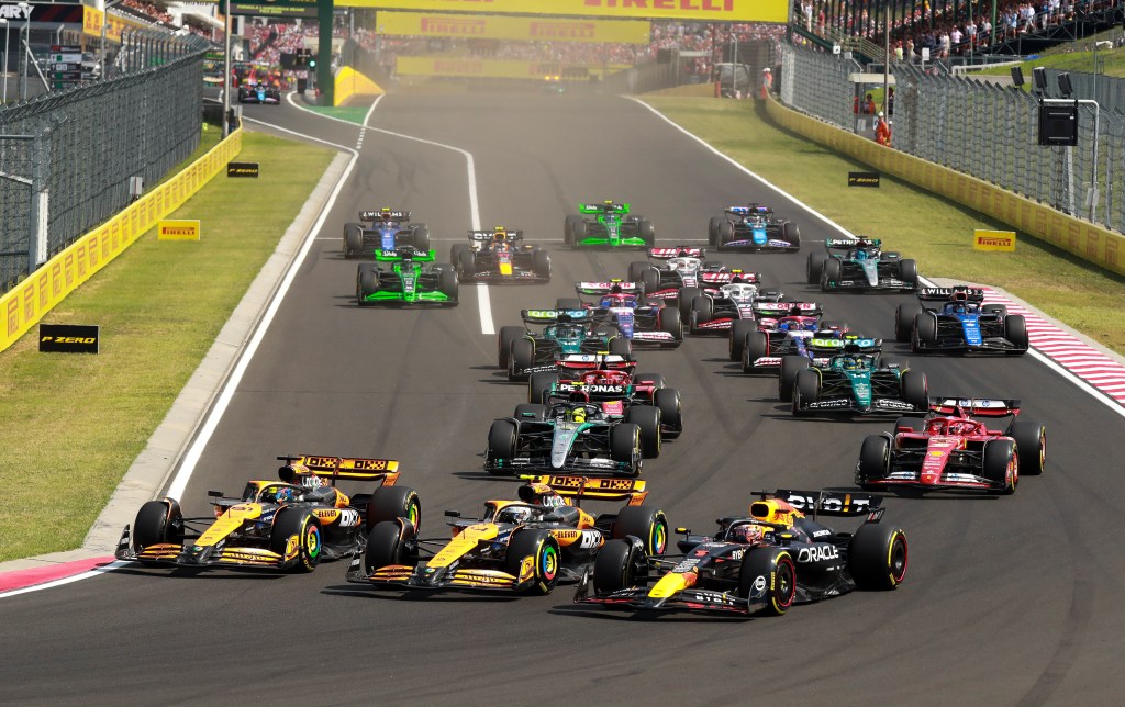 BUDAPEST, HUNGARY - JULY 21: (L-R) Oscar Piastri of Australia driving the (81) McLaren MCL38 Mercedes, Lando Norris of Great Britain driving the (4) McLaren MCL38 Mercedes and Max Verstappen of the Netherlands driving the (1) Oracle Red Bull Racing RB20 into turn one during the F1 Grand Prix of Hungary at Hungaroring on July 21, 2024 in Budapest, Hungary. (Photo by Song Haiyuan/MB Media/Getty Images)