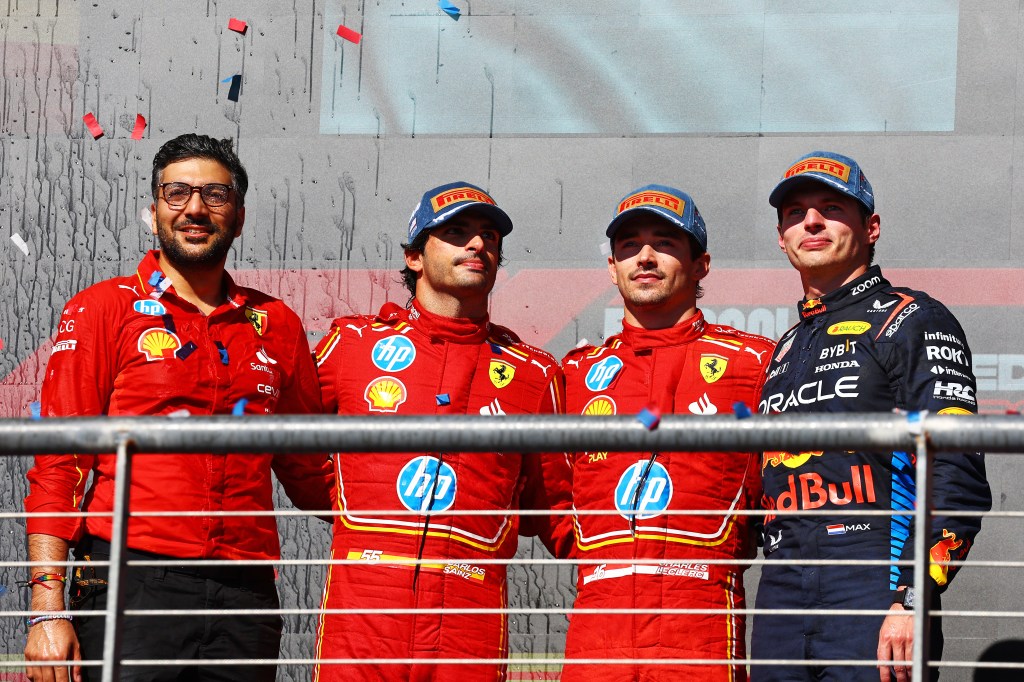AUSTIN, TEXAS - OCTOBER 20: Race winner Charles Leclerc of Monaco and Ferrari, Second placed Carlos Sainz of Spain and Ferrari and Max Verstappen of the Netherlands and Oracle Red Bull Racing pose for a photo on the podium after the F1 Grand Prix of United States at Circuit of The Americas on October 20, 2024 in Austin, Texas. (Photo by Mark Thompson/Getty Images)