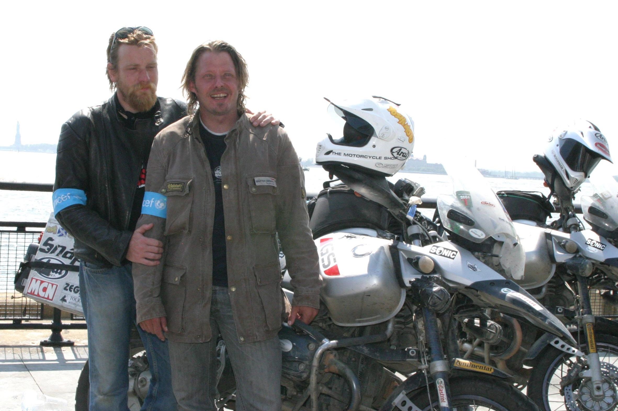 Charley Boorman, Ewan McGregor during Ewan McGregor and Charley Boorman complete the "Long Way Round" at Battery Park in New York, New York, United States. (Photo by M. Von Holden/FilmMagic)