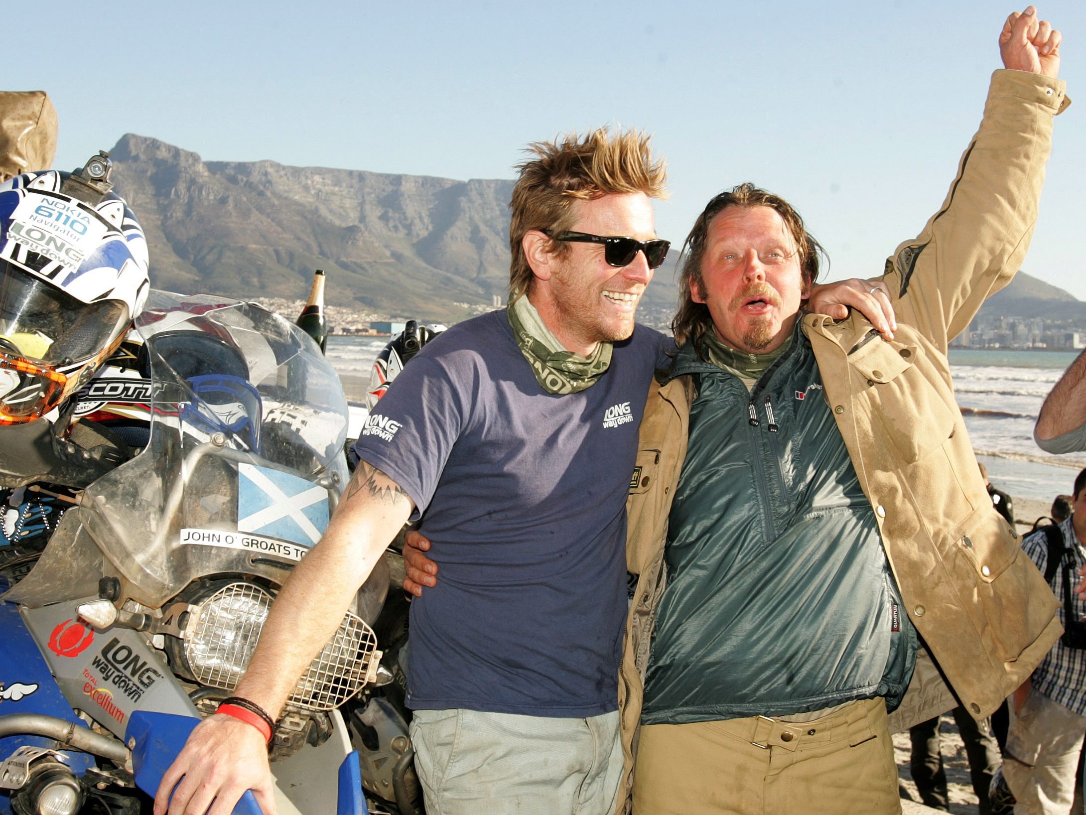 CAPE TOWN, SOUTH AFRICA - JULY 4: Ewan McGregor and Charley Boorman arrive at the end of their ?Long Way Down' trip, on August 4, 2007 in Cape Town, South Africa. United Nations Children's Fund (UNICEF) Goodwill Ambassador, Ewan McGregor and Charley Boorman, travelled over 15,000 miles on motorcycles from John O'Groats in Scotland to South Africa. Long Way Down is also being made into a TV series. In 2004 they conducted a similar trip, called ?Long Way Round? which saw them travel from London to New York. (Photo by Ron Gaunt/Getty Images for Long Way Down)