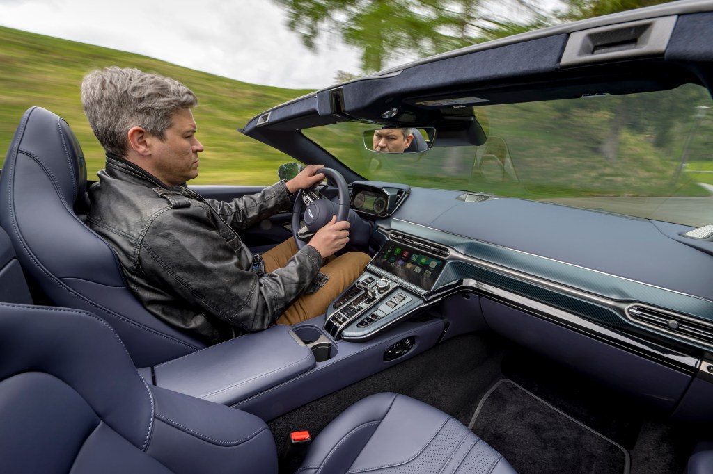 Will Dron driving the 2025 Aston Martin Vantage Roadster 